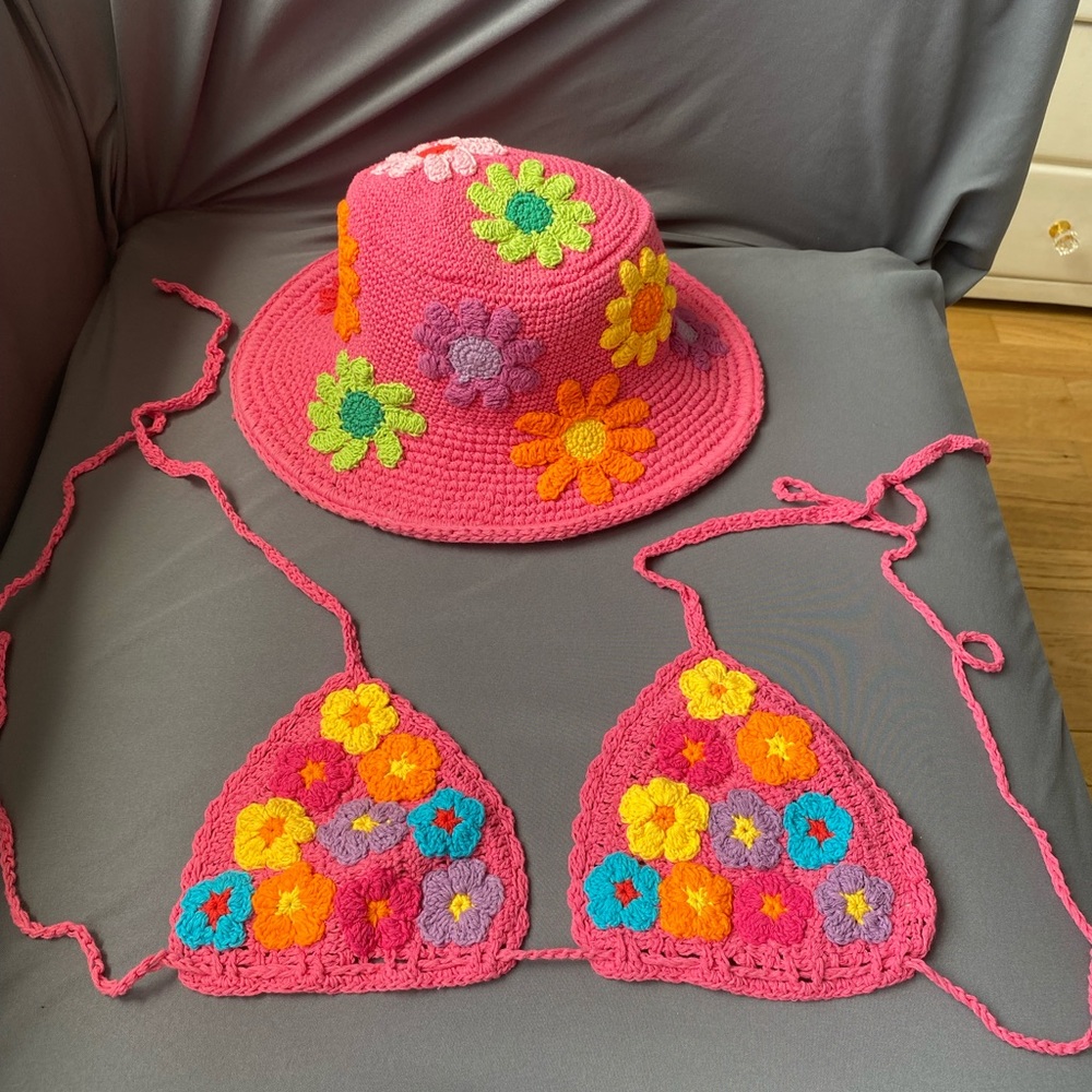 Pink knit bikini top with colorful flowers and matching knit hat sold separately